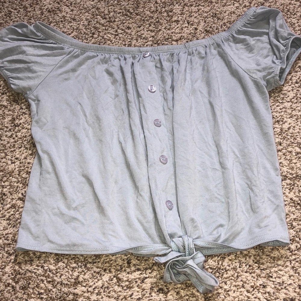 Off the shoulder blue top that ties at the bottom.
